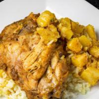 Curry Chicken Plate · Spiced and slow cooked chicken served in a spicy and savory curry gravy with 2 sides