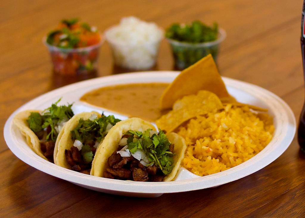 3 Tacos Combo · Tacos are prepared with your choice of meat, onions, and cilantro. Served with rice and beans.