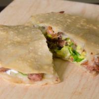 Mulita · Described as sandwiched tacos with cheese, your choice of meat, onions, and cilantro.