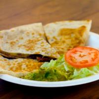 Quesadilla · Choice of protein w melted Cheese and flour tortilla.  Served with sour cream and guacamole.