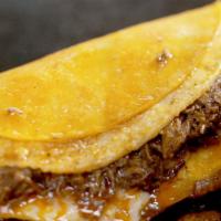 Quesabirria · Large birria tacos made with cheese and dipped in red sauce. comes with small side of birria...