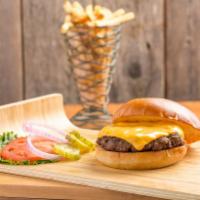 The House Burger · Hand formed patty with lettuce, tomatoes, red onions and pickles. Served with seasoned fries.