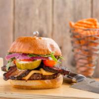 The Milburger · 1/3 lb burger with thick-cut bacon, smoked gouda, baby arugula, cherry tomatoes, sweet horse...
