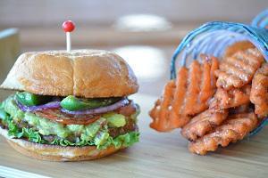 Veggie Burger · Black bean patty with guacamole, grilled jalapeño, lettuce, tomatoes and red onions with swe...