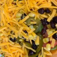 Mexican Salad · Baby greens, tomato, cheddar, corn and red beans, jalapenos in a tostada shell, salsa, sour ...