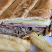 Cuban Sandwich · Latin roast pork or turkey, ham, Swiss, pickles, mustard on a grill-pressed club roll and fr...