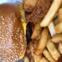 Deluxe Burger · Lettuce, tomato, fries and onions rings. 1/2 lb Angus ground beef.