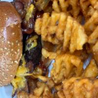 Texas Burger · Bacon, BBQ sauce, cheddar and sweet potato fries. 1/2 lb Angus ground beef.