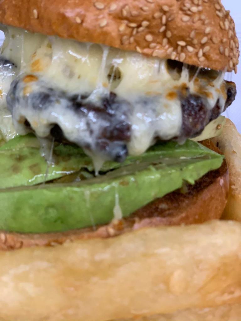 Spicy Latino Burger · Jalapenos, pepper jack cheese, avocado and fried yucca. 1/2 lb Angus ground beef.