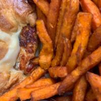 Salmon Burger · On a jumbo croissant, Swiss, chipotle mayo and sweet potato fries. 1/2 lb Angus ground beef.