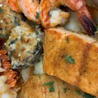 Captain's Feast · Tilapia, 5 oz. Lobster tail, salmon, jumbo shrimp and clams .