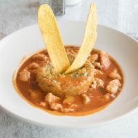 Mofongo with Chicken Breast · Onion, pepper and tomato sauce in a fried plantain shell.