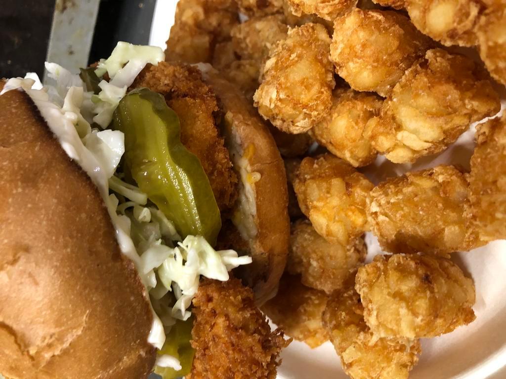 Chicken Sandwich · Chicken on a toasted kaiser bun with tartar or mayo topped with pickles and coleslaw with tot's or equivalent . Add cheese tomatoes for an additional charge.