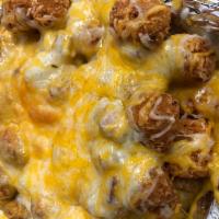 Chowder Bomb · Tot's covered in chowder smothered in cheese.