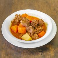 Beef Stew · Beef stew, served with rice, beans and salad.