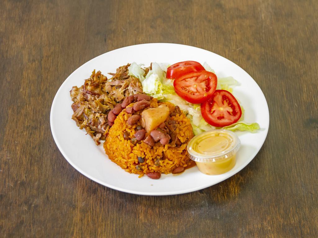Pull Pork / Pernil · Slowly cooked pork served with rice beans and salad.