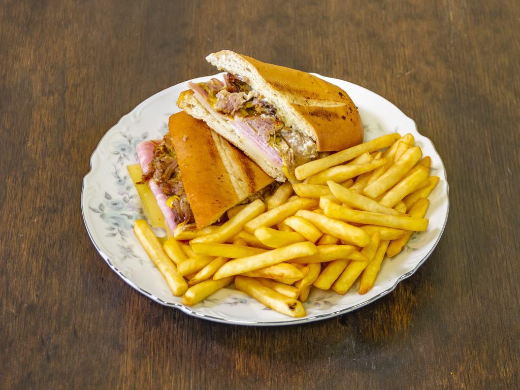 Cuban Sandwich Combo · Cubano sandwich. Ham, pulled pork, Swiss cheese, and mayo ketchup, lettuce, and tomato. French fries.
