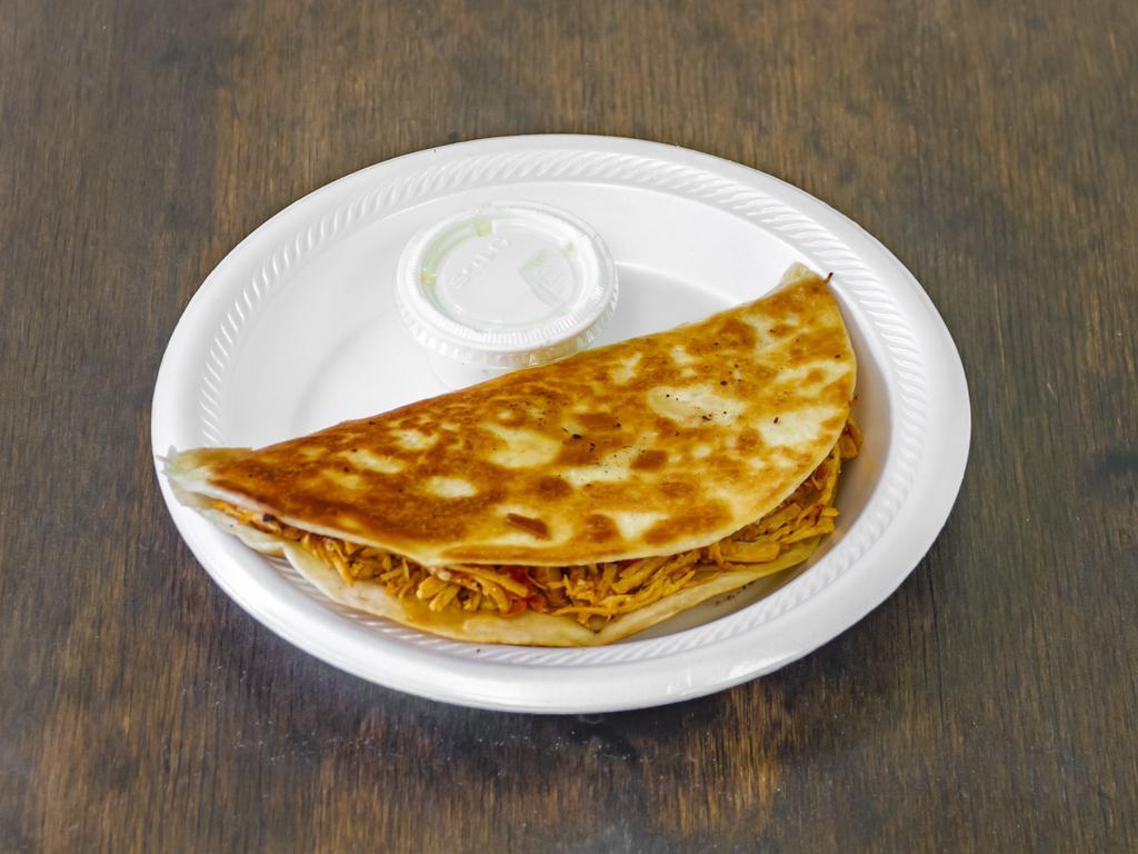 Quesadilla Chicken · Flour Tortilla filled with Chicken breast cooked with onions and tomato wrap and Fried to get that crispines.