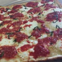 Brooklyn Tomato Pie · Sicilian thin crust with fresh mozzarella, basil, olive oil and San Marzano tomato sauce.