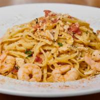 Seafood Pasta Plate · Shrimp and crab sauteed in a Cajun white wine sauce over linguini. 