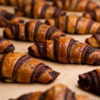 Rugelach  · Soft, flakey, mini croissant shaped chocolate rugelach. (contains dairy and nuts)