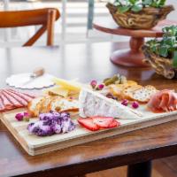 Cheese and Charcuterie  · Chef's choice: 2 meats and 3 cheeses. Served with cornichons, drive fruit, mustard and crost...