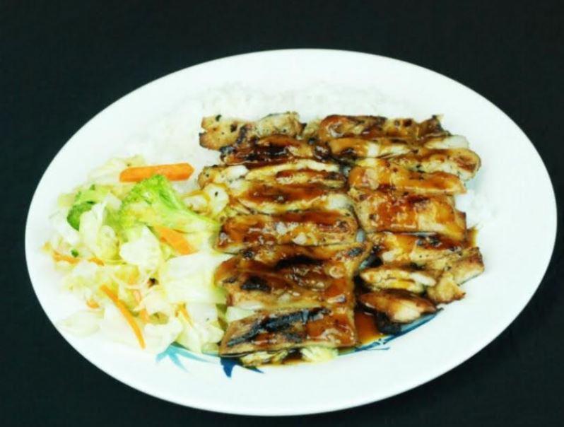 2. Chicken Teriyaki · Sliced chicken with veggie over steamed rice.