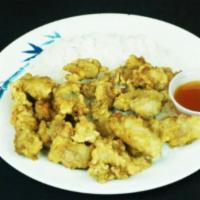 7. Sweet and Sour Chicken · Deep fried chicken served with sweet and sour sauce over rice.