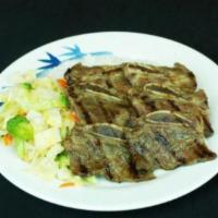 9. Beef Short Rib · Sliced beef short rib with veggie over steamed rice.