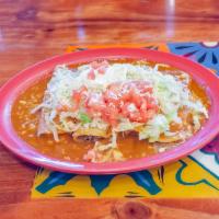 Enchilada Supremas · 4 rolled corn soft tortillas. 1 beef, 1 chicken, 1 cheese and 1 bean. Topped with enchilada ...
