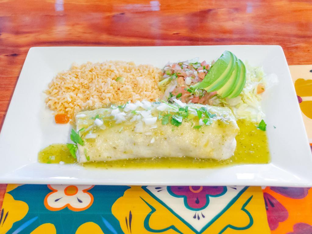 Burrito Autentico · A large flour tortilla with beans inside and your choice of meat steak, chicken, al pastor or carnitas. Covered in green sauce. Served with rice and salad.