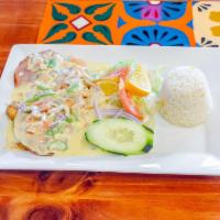 Pollo Monterrey · Grilled chicken breast covered with special creamy mushroom sauce and ham. Served with rice ...