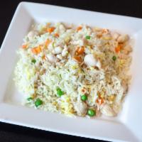 Chicken Fried Rice · Chicken pan-fried with steamed rice, eggs, peas and carrots.
