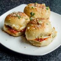 Egglplant Slider (1) · Breaded eggplant inside our house-made garlic knots with house-made marinara and fresh mozza...