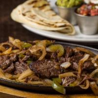 Fajitas · Choice of chicken, steak or shrimp, sizzling with peppers and onions with rice, sour cream, ...