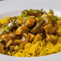 Irish Chicken Curry · A local favorite cooked low and slow, served over rice, and hand-cut fries