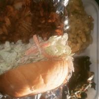 Pulled Jackfruit Sandwhich · Jackfruit savory BBQ sauce tangy spicy coleslaw with greens vegan macaroni and cheese.