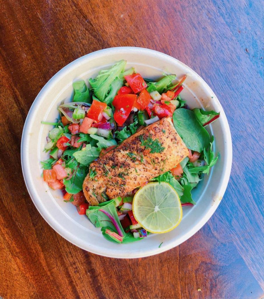 Roasted Salmon Salad · Herb marinated, roasted salmon over mixed spring green salad, Israeli salad and Foreverything pickles. GLUTEN FREE