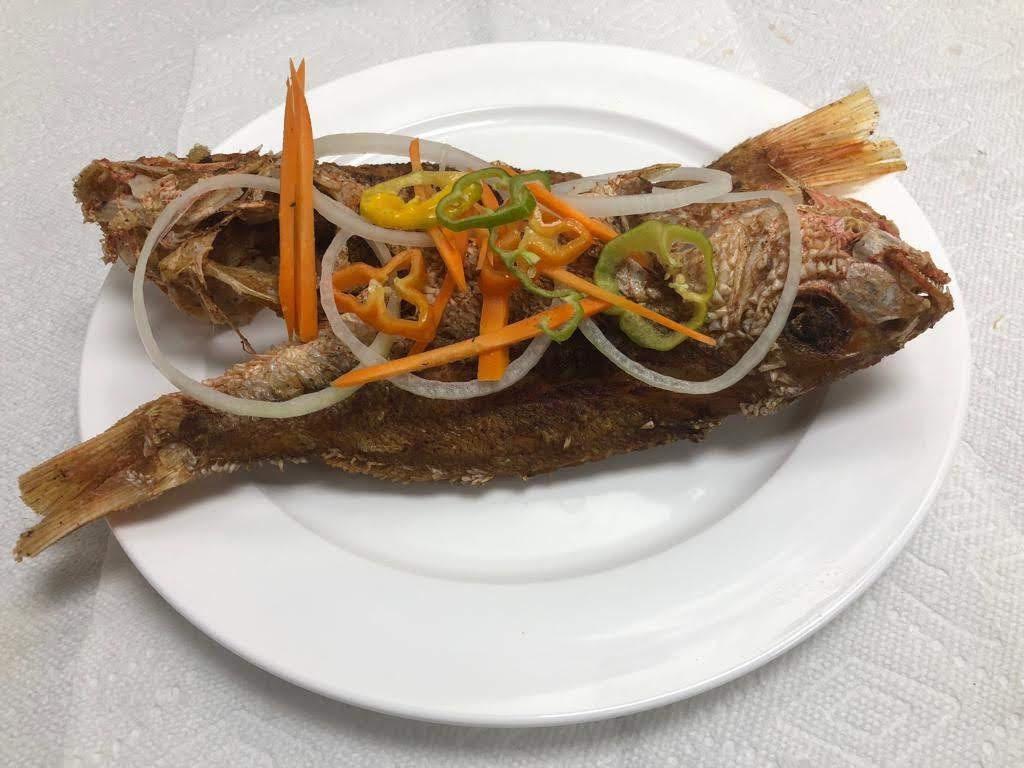 Snapper · Pan fried topped with pickled onions, carrots and peppers to your taste.