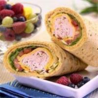 Forest Ham Wrap · Black Forest ham, Alpine Lace cheese, sun-dried tomatoes, spinach, and honey mustard.