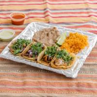 Taco Plate · 4 tacos with your choice of meat, served with a side of rice and beans.
