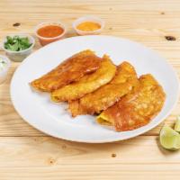 Tacobijado (4) · Corn tortilla with cheese - crusted shell with your choice of protein.