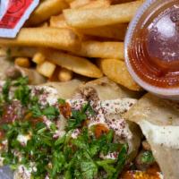 Chicken Arabi  · Chicken, lettuce, onions, tomatoes, garlic sauce, hot sauce, fr