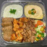 Tri-Meat Plate · Chicken, lamb, beef, rice, salad , hummus, taziki, garlic sauce, hot sauce