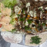 Beef plate · Beef, rice, salad, hummus, taziki, garlic sauce, hot sauce. 