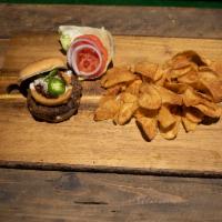 Texan Burger · Onion ring, chopped brisket, queso, and fresh jalapeno.