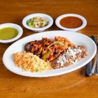 Fajitas Mixtas · Chicken, beef, and shrimp with onions, and green peppers topped with special red sauce.