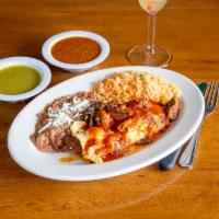 Bistec Tapatio · Shell steak split in 1/2 stuffed with Mexican cheese topped with onions, mushrooms and a spe...