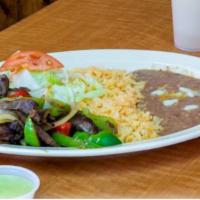 Carne Asada · Grilled beef served with rice, beans, pico de gallo, grilled onions, and corn tortillas.