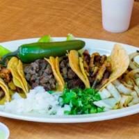 Street Tacos · 5 taquitos on corn tortilla choice of Asada chicken or pork. Served with onions cilantros.